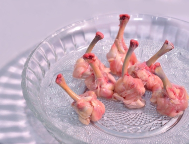 These are made from chicken wings. They are shaped like small drumsticks. 